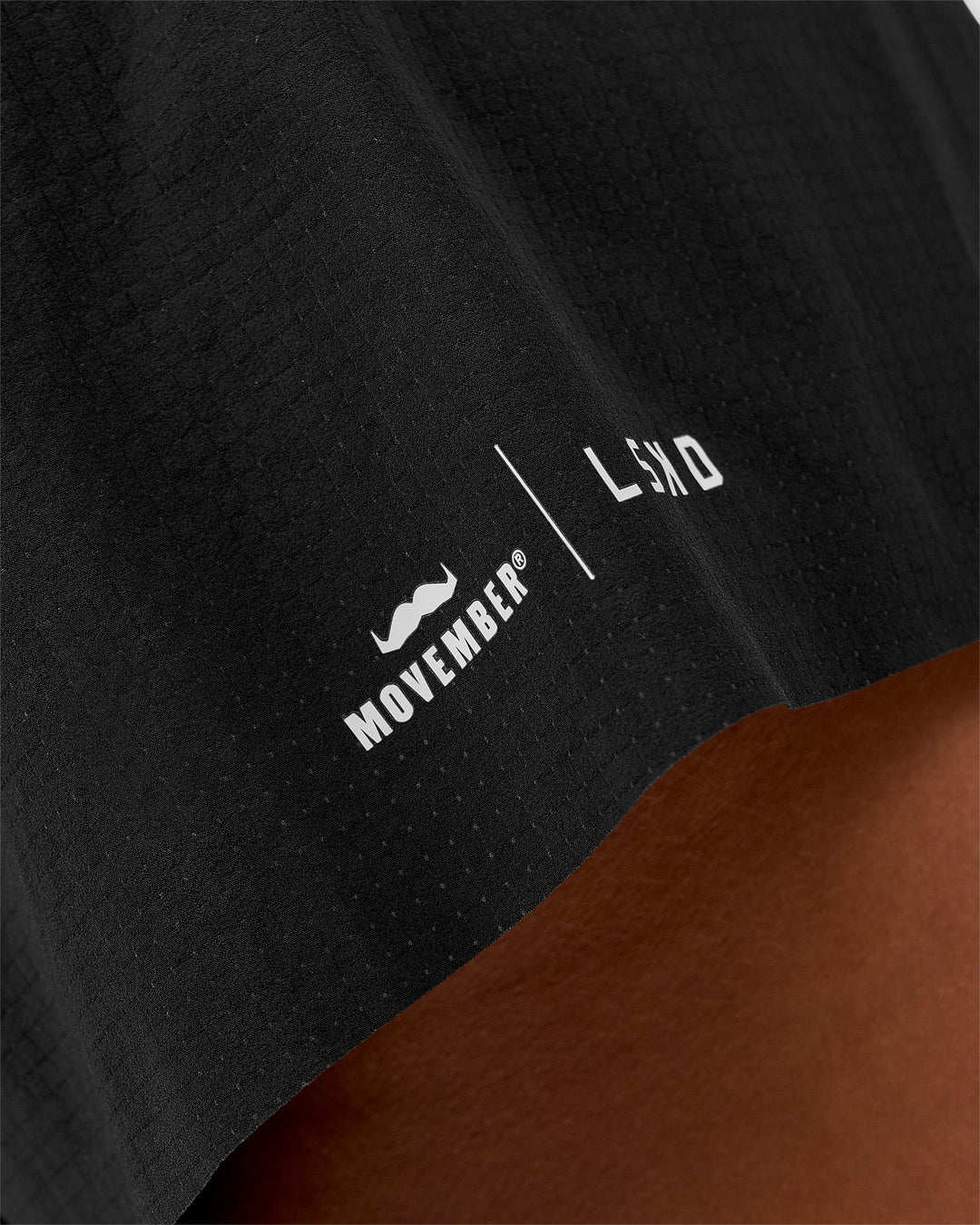 Woman wearing Movember x LSKD Accelerate 3" High-Rise Running Short - Black | Model:Charli | Size:XS - view 6