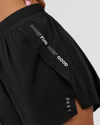 Woman wearing Movember x LSKD Accelerate 3" High-Rise Running Short - Black | Model:Charli | Size:XS | Thumbnail Index: 7