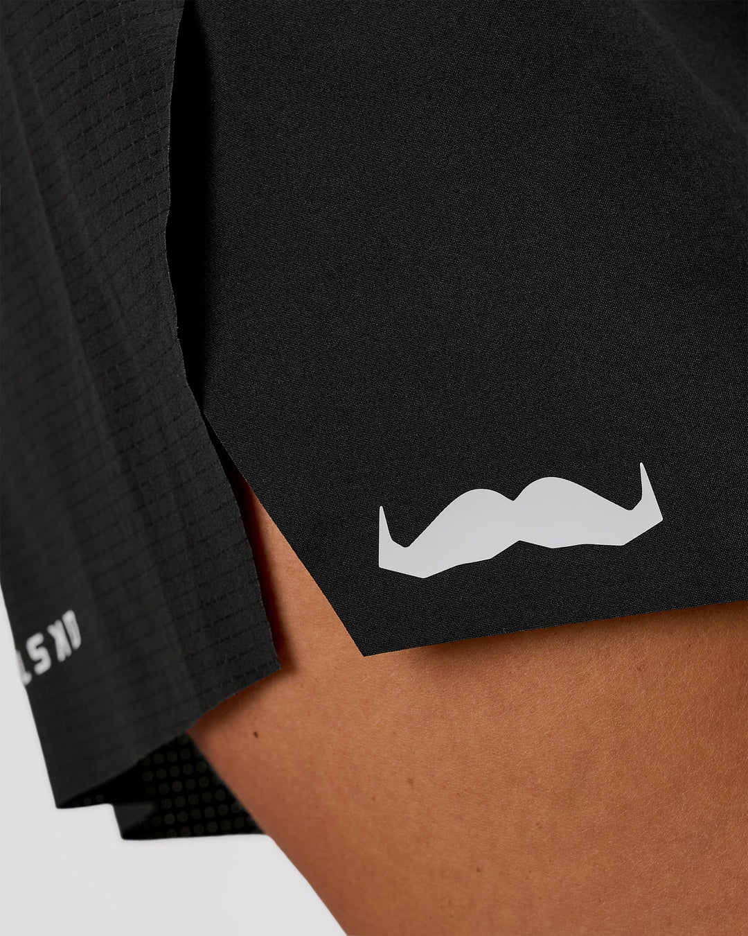 Woman wearing Movember x LSKD Accelerate 3" High-Rise Running Short - Black | Model:Charli | Size:XS - view 12