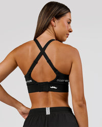 Woman wearing Movember x LSKD Accelerate Sports Bra - Black | Model:Charli | Size:XS | Thumbnail Index: 3