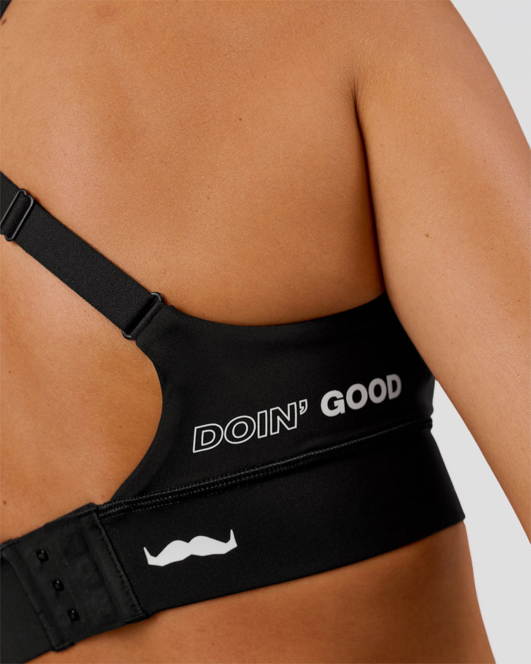 Woman wearing Movember x LSKD Accelerate Sports Bra - Black | Model:Charli | Size:XS - view 6