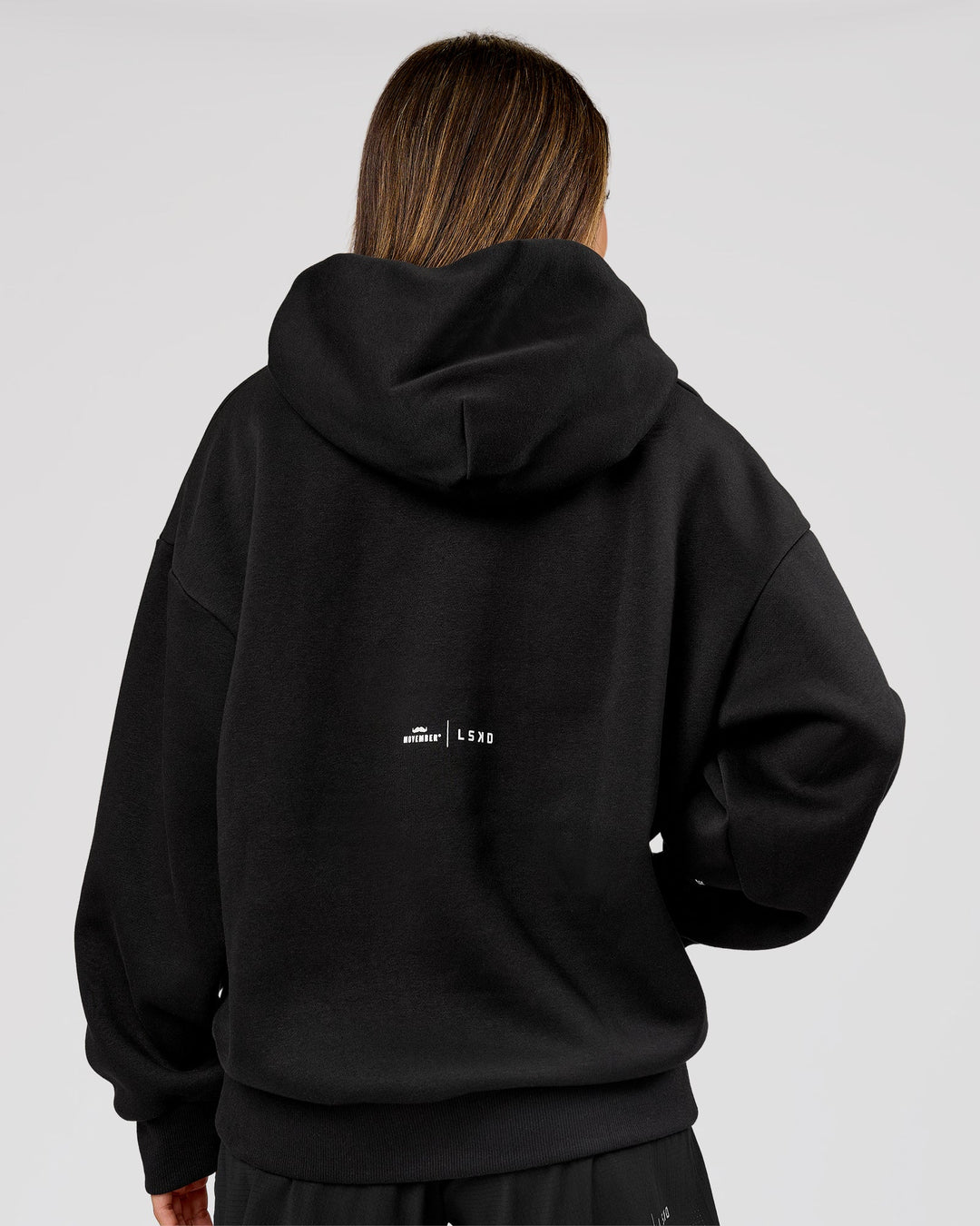 Woman wearing Movember x LSKD Oversized Hoodie - Black | Model:Charli | Size:XS - view 5