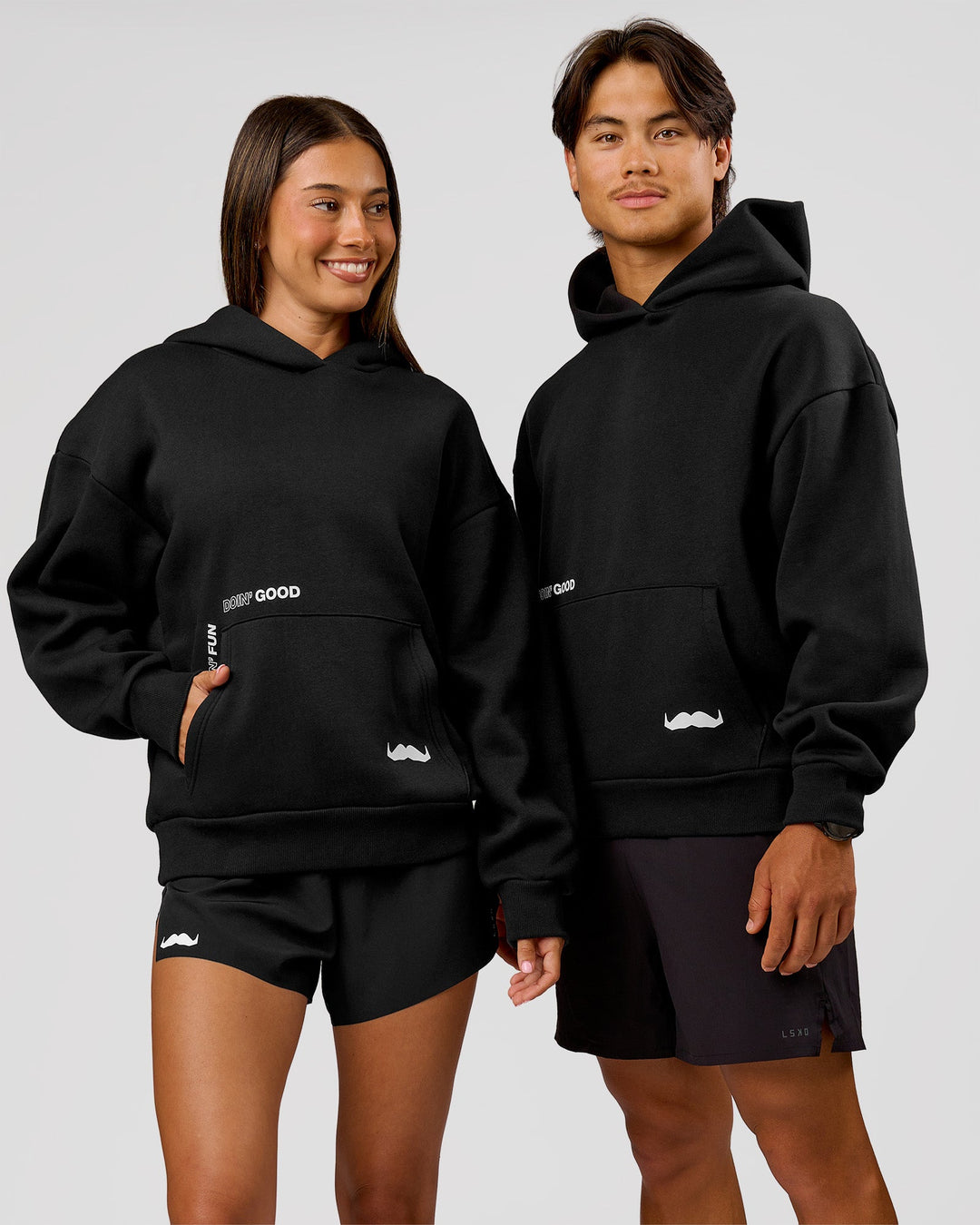 Woman wearing Movember x LSKD Oversized Hoodie - Black | Model:Charli | Size:XS - view 1
