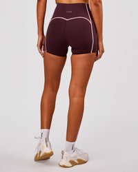 Woman wearing Power Ultra High-Rise 4" Short Pockets - Cherry Lacquer-Pink Rose | Model:Charli | Size:XS | Thumbnail Index: 4
