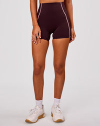 Woman wearing Power Ultra High-Rise 4" Short Pockets - Cherry Lacquer-Pink Rose | Model:Charli | Size:XS | Thumbnail Index: 6