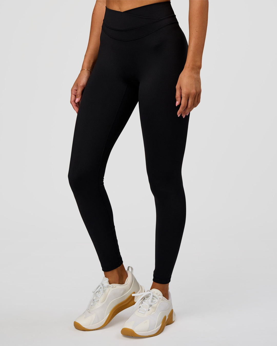 Woman wearing Solstice High-Rise Full Length Legging - Black | Model:Charli | Size:XS - view 3