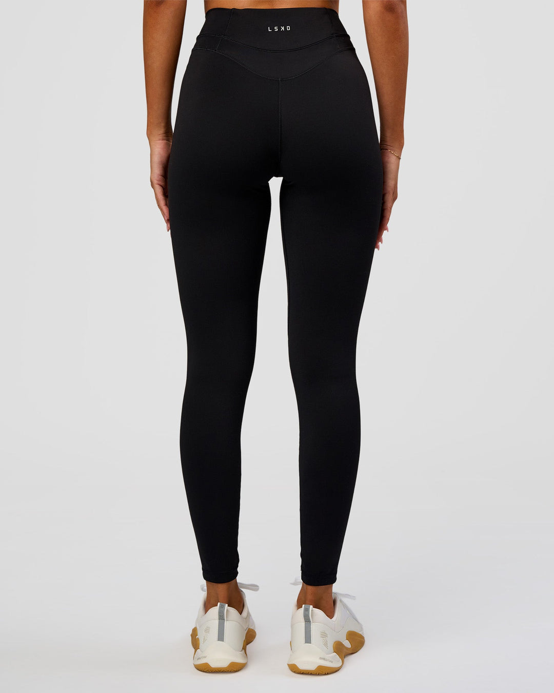Woman wearing Solstice High-Rise Full Length Legging - Black | Model:Charli | Size:XS - view 5
