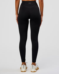 Woman wearing Solstice High-Rise Full Length Legging - Black | Model:Charli | Size:XS | Thumbnail Index: 4