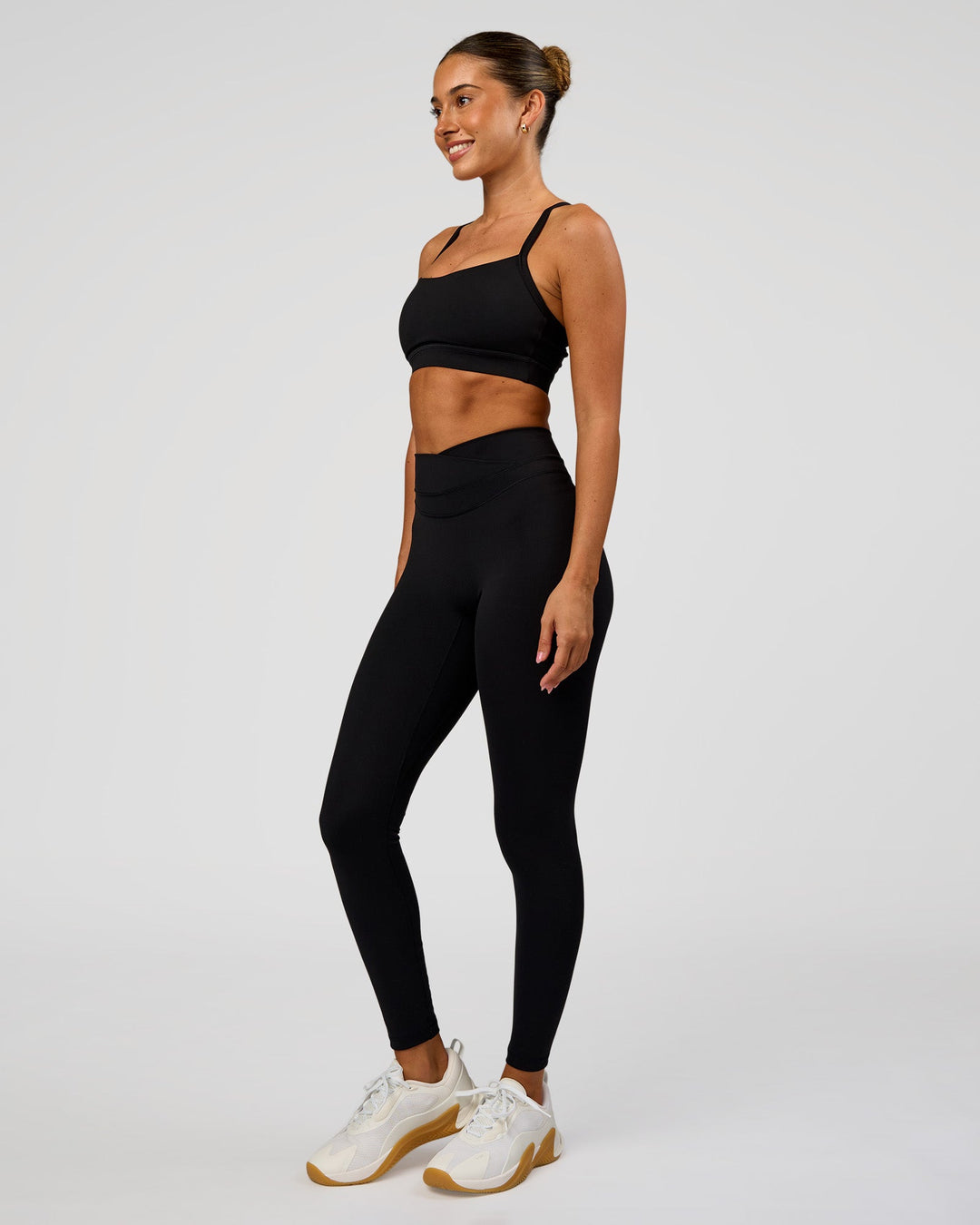 Woman wearing Solstice High-Rise Full Length Legging - Black | Model:Charli | Size:XS - view 7