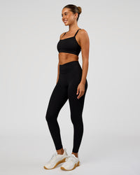 Woman wearing Solstice High-Rise Full Length Legging - Black | Model:Charli | Size:XS | Thumbnail Index: 6