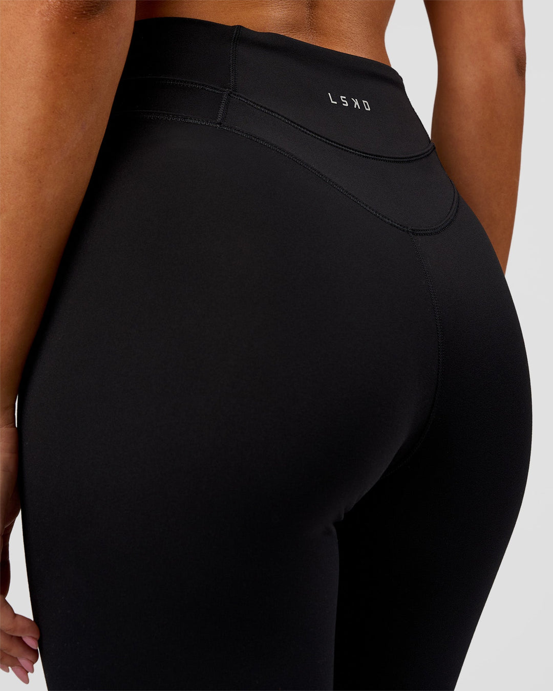 Woman wearing Solstice High-Rise Full Length Legging - Black | Model:Charli | Size:XS - view 4