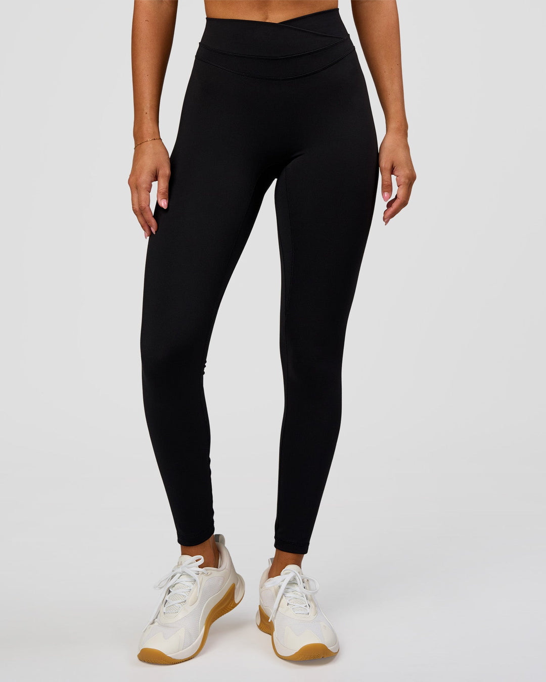 Woman wearing Solstice High-Rise Full Length Legging - Black | Model:Charli | Size:XS - view 8