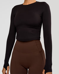 Woman wearing Staple Long Sleeve Cropped Tee 2.0 - Black | Model:Charli | Size:XS | Thumbnail Index: 2