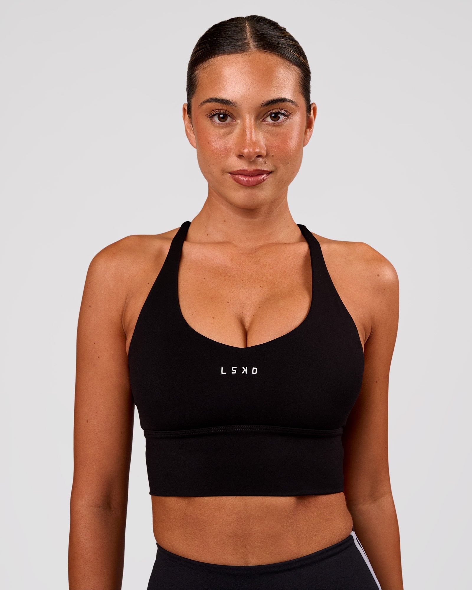 Woman wearing Stellar Long Line Sports Bra - Black-White | Model:Charli | Size:XS