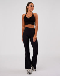 Woman wearing Stellar Long Line Sports Bra - Black-White | Model:Charli | Size:XS | Thumbnail Index: 3
