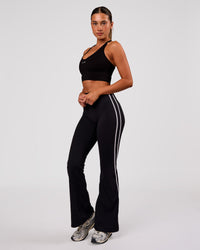 Woman wearing Stellar Long Line Sports Bra - Black-White | Model:Charli | Size:XS | Thumbnail Index: 5