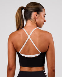 Woman wearing Stellar Long Line Sports Bra - Black-White | Model:Charli | Size:XS | Thumbnail Index: 6