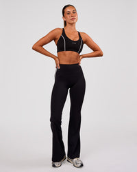 Woman wearing Stellar Sports Bra - Black-White | Model:Charli | Size:XS | Thumbnail Index: 2