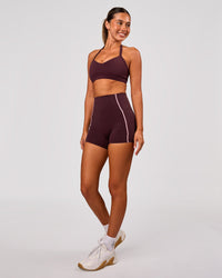 Woman wearing Unleash Sports Bra - Cherry Lacquer | Model:Charli | Size:XS | Thumbnail Index: 4