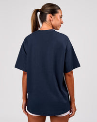Woman wearing Varsity EST Heavyweight Oversized Tee  - Future Navy-White | Model:Charli | Size:XS | Thumbnail Index: 3