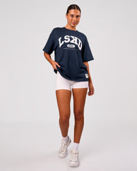 Woman wearing Varsity EST Heavyweight Oversized Tee  - Future Navy-White | Model:Charli | Size:XS | Thumbnail Index: 5