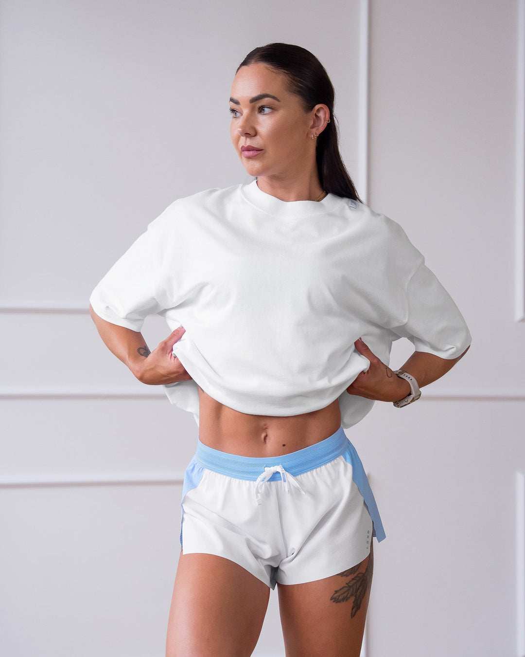 Woman wearing Accelerate 3" Mid-Rise Running Short - Open Air-White | Model:Charlotte | Size:XS - view 12