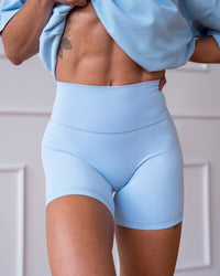 Woman wearing Strong is Beautiful Fusion High-Rise 6" Short - Open Air | Model:Charlotte | Size:XS | Thumbnail Index: 0