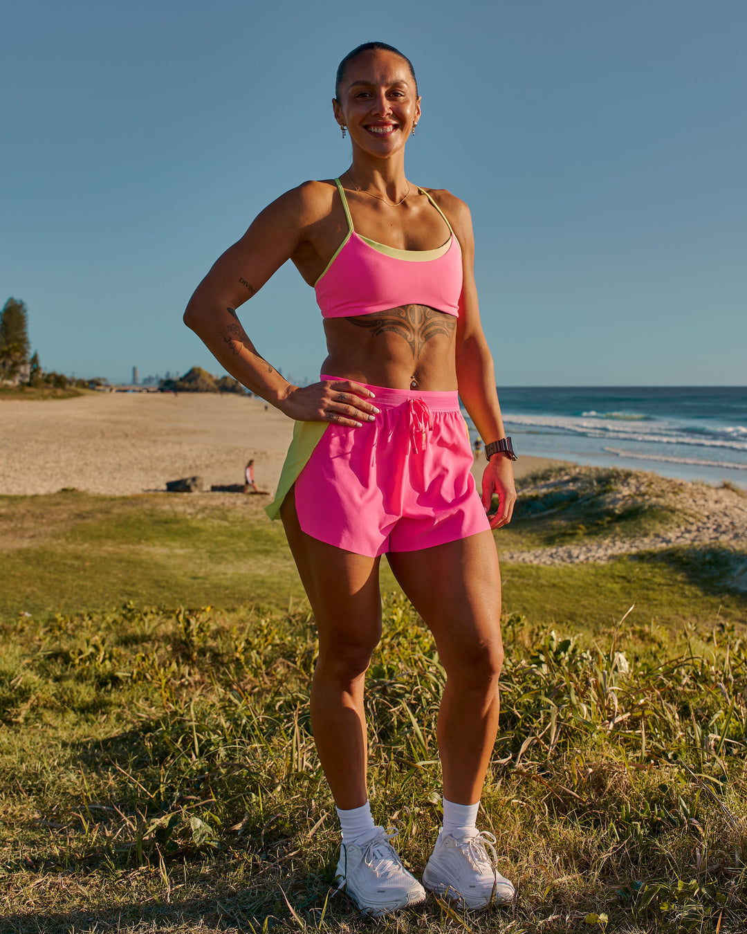 Woman wearing Accelerate 3" High-Rise Running Short - Lime Glo-Sugar Plum | Model:Chelsea | Size:XS - view 2