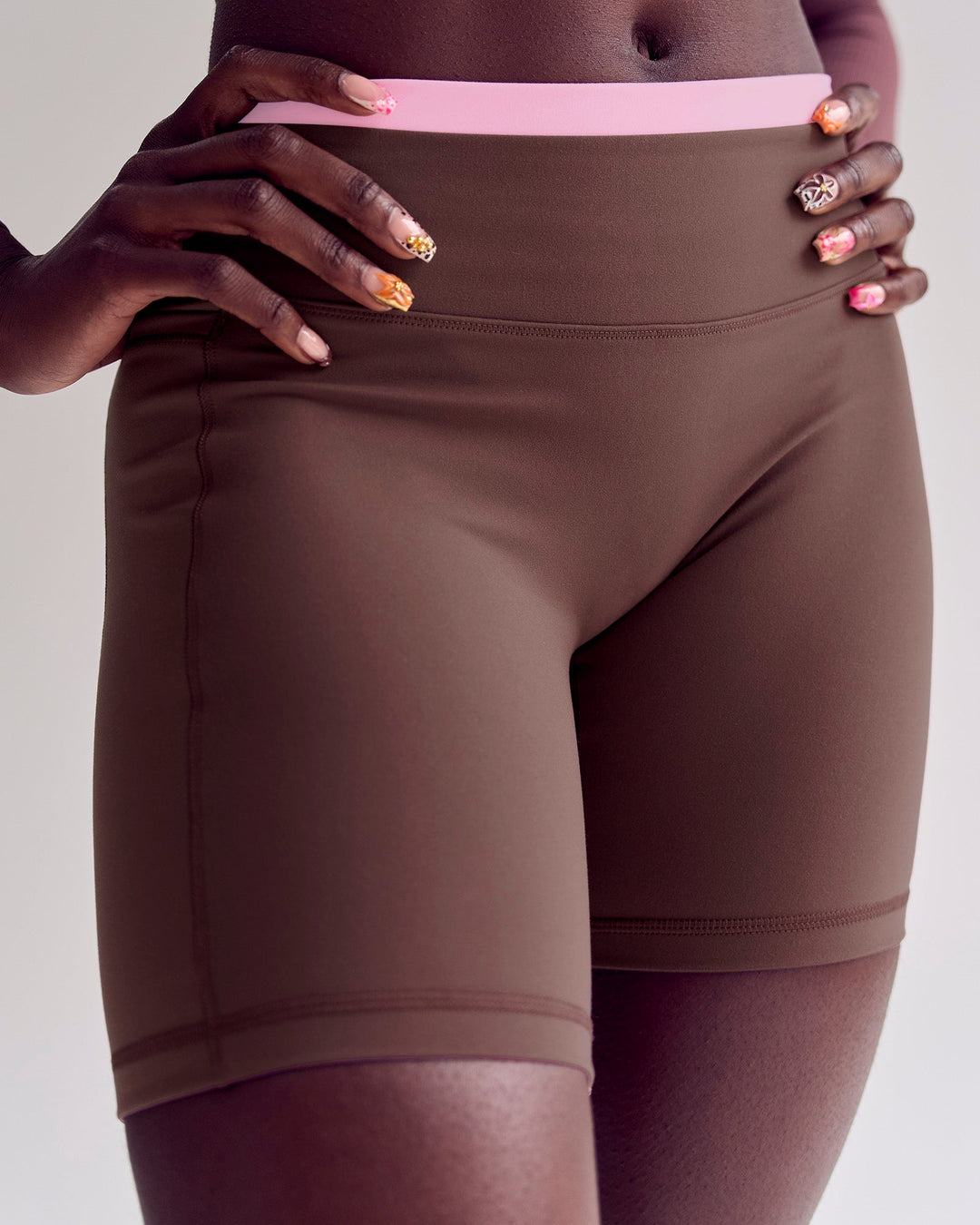 Woman wearing Bree Fusion High-Rise 6" Short Pockets - Cocoa Powder-Pink Rose | Model:Desleigh | Size:XS - view 3