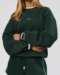 Woman wearing Go-To Dual Oversized Sweater - Midnight Green-White | Model:Georgia | Size:XS | Thumbnail Index: 0