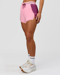 Woman wearing Accelerate 3" High-Rise Running Short - Boysenberry-Pink Rose | Model:Issy | Size:XS | Thumbnail Index: 4