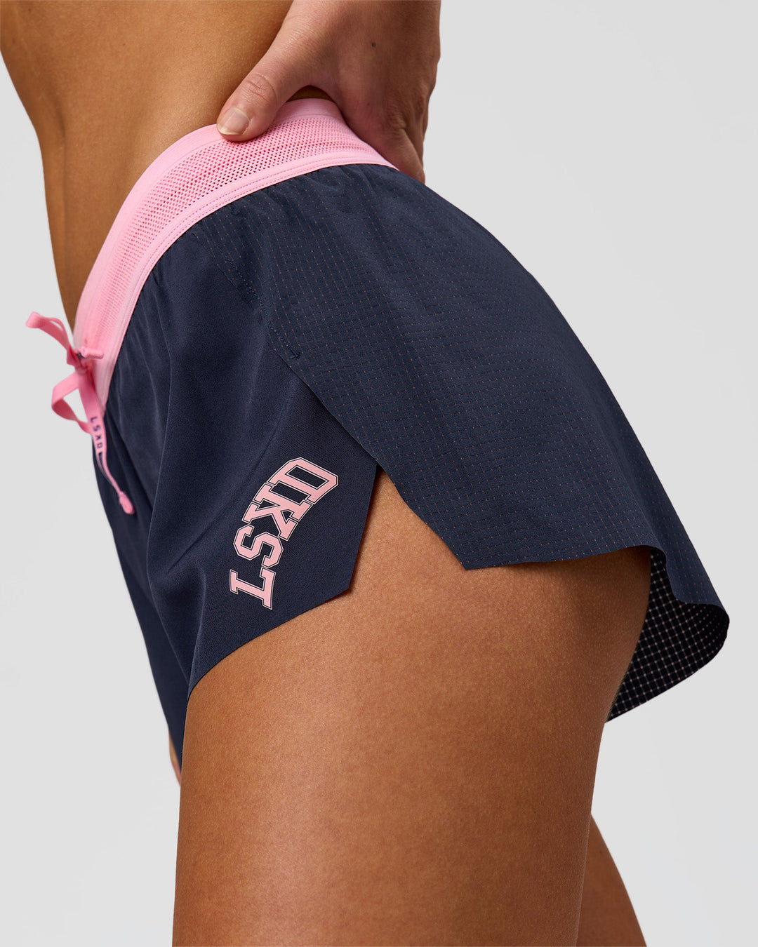 Woman wearing Accelerate 3" Mid-Rise Running Short - Future Navy-Varsity Print | Model:Issy | Size:XS - view 4