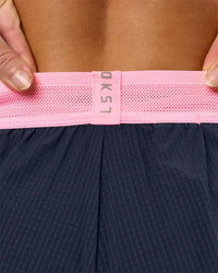 Woman wearing Accelerate 3" Mid-Rise Running Short - Future Navy-Varsity Print | Model:Issy | Size:XS | Thumbnail Index: 10