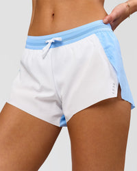 Woman wearing Accelerate 3" Mid-Rise Running Short - Open Air-White | Model:Issy | Size:XS | Thumbnail Index: 5