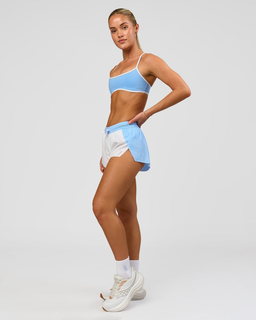 Woman wearing Accelerate 3" Mid-Rise Running Short - Open Air-White | Model:Issy | Size:XS - view 11