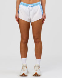 Woman wearing Accelerate 3" Mid-Rise Running Short - Open Air-White | Model:Issy | Size:XS | Thumbnail Index: 4
