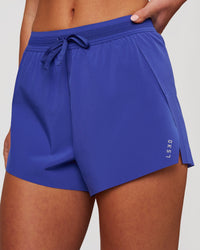 Woman wearing Accelerate 3" High-Rise Running Short - Power Cobalt | Model:Issy | Size:XS | Thumbnail Index: 0