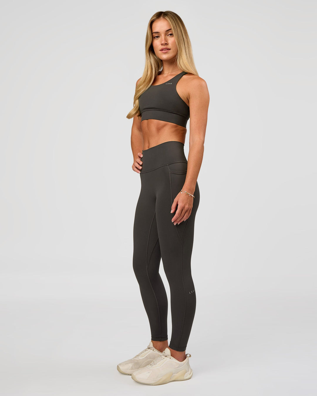 Woman wearing Accelerate Sports Bra - Onyx | Model:Issy | Size:XS - view 6