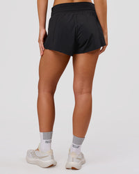 Woman wearing Accelerate Synergy 3" Running Short Short - Black-Black | Model:Issy | Size:XS | Thumbnail Index: 10