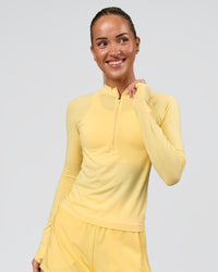 Woman wearing AeroFLX+ Long Sleeve Half Zip - Lemon/Lemon | Model:Issy | Size:XS | Thumbnail Index: 0