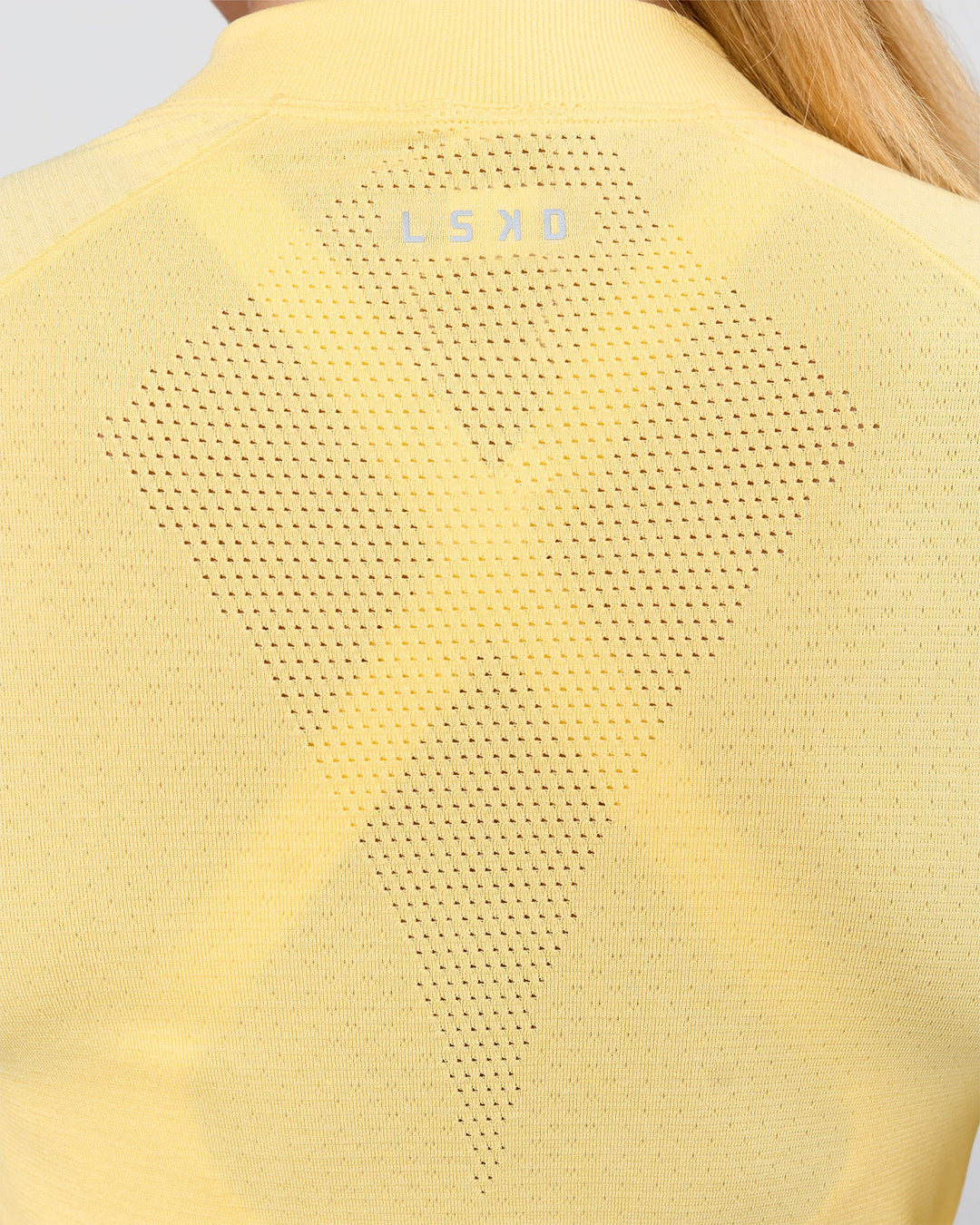 Woman wearing AeroFLX+ Long Sleeve Half Zip - Lemon/Lemon | Model:Issy | Size:XS - view 4