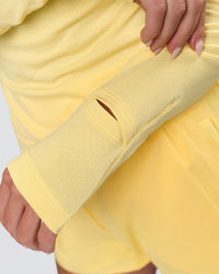 Woman wearing AeroFLX+ Long Sleeve Half Zip - Lemon/Lemon | Model:Issy | Size:XS | Thumbnail Index: 8