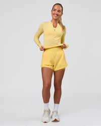 Woman wearing AeroFLX+ Long Sleeve Half Zip - Lemon/Lemon | Model:Issy | Size:XS | Thumbnail Index: 10