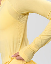 Woman wearing AeroFLX+ Long Sleeve Half Zip - Lemon/Lemon | Model:Issy | Size:XS | Thumbnail Index: 11
