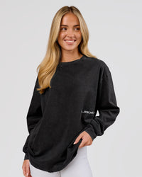 Woman wearing Backline Washed Heavyweight Oversized LS Tee - Black Washed | Model:Issy | Size:XS | Thumbnail Index: 3