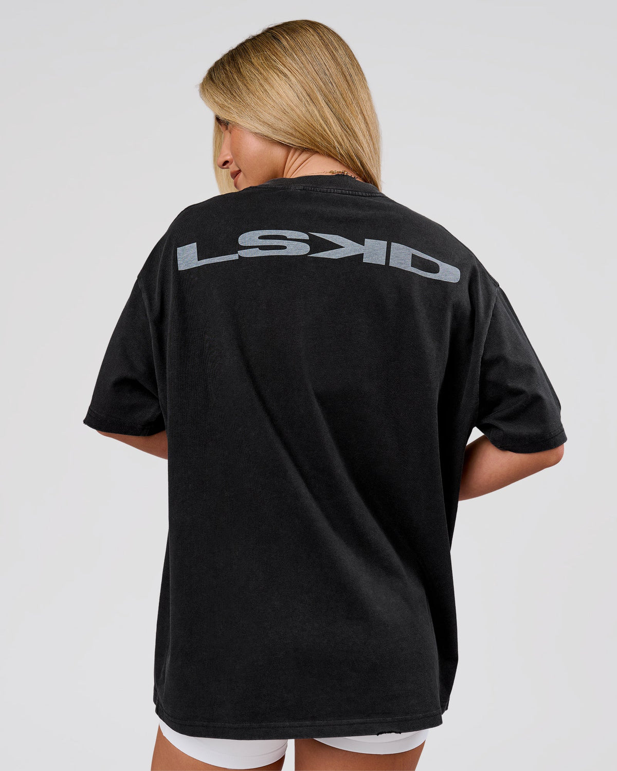 Woman wearing Backline Washed Heavyweight Oversized Tee - Black Washed | Model:Issy | Size:XS - view 2