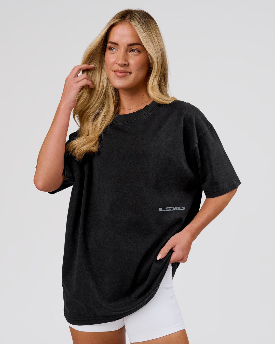 Woman wearing Backline Washed Heavyweight Oversized Tee - Black Washed | Model:Issy | Size:XS - view 4