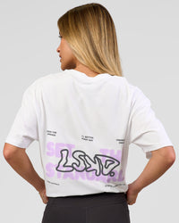 Woman wearing Benchmark FLXCotton Oversized Tee - White-Pale Lilac | Model:Issy | Size:XS | Thumbnail Index: 2