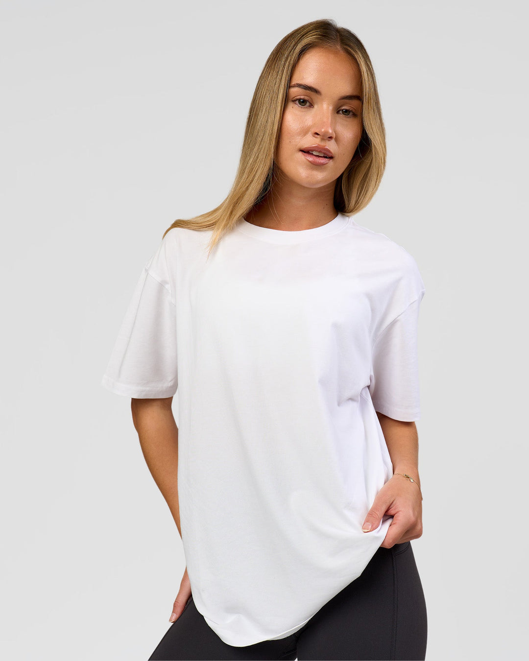 Woman wearing Benchmark FLXCotton Oversized Tee - White-Pale Lilac | Model:Issy | Size:XS - view 6