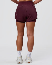 Woman wearing Challenger 3" Lined Performance Short - Cherry Lacquer | Model:Issy | Size:XS | Thumbnail Index: 10